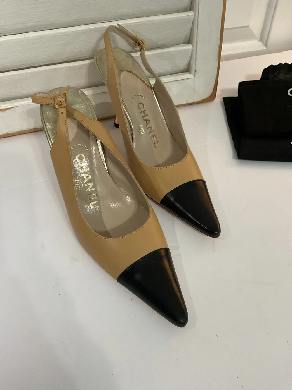 CHANEL Beige and Black Pointed Slingback Pumps